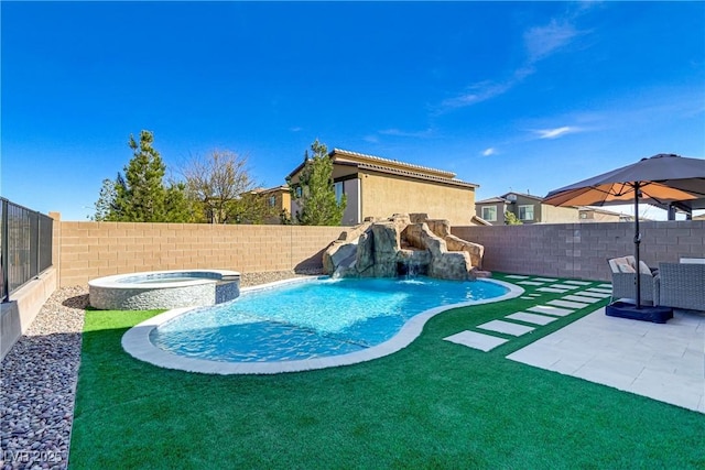 view of pool featuring a fenced backyard, a pool with connected hot tub, and a patio