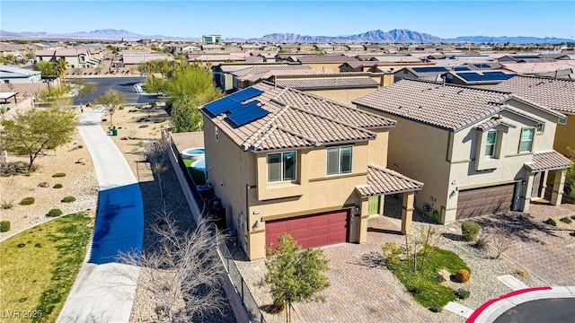 birds eye view of property with a residential view and a mountain view