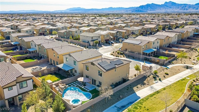 drone / aerial view with a residential view and a mountain view