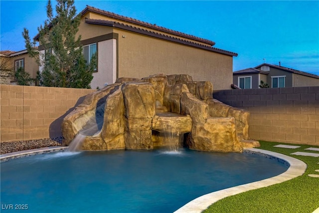 view of pool with fence