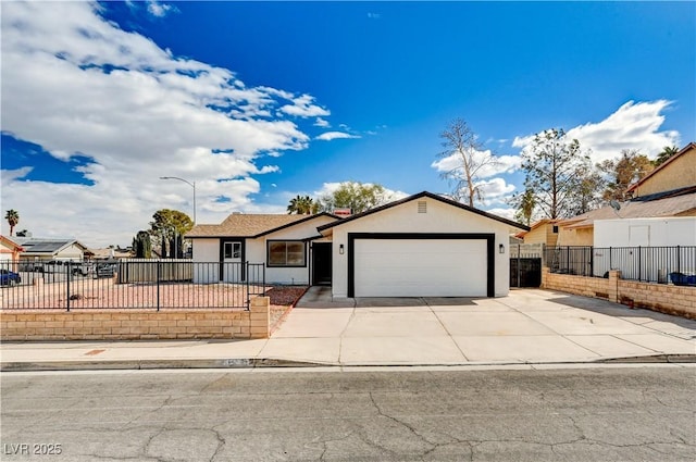 ranch-style house with driveway, a garage, a fenced front yard, and stucco siding