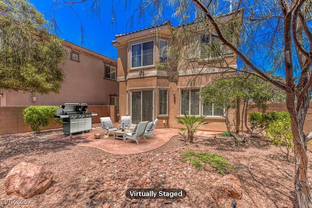 back of property featuring a patio, fence, and stucco siding