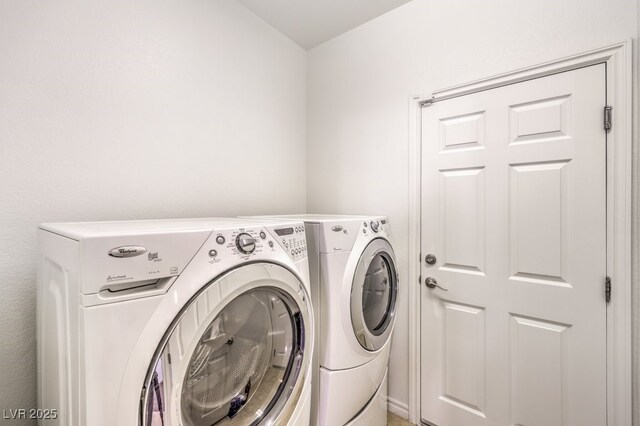 clothes washing area with laundry area and washer and dryer