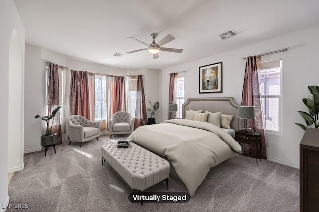 bedroom with carpet floors, multiple windows, and visible vents