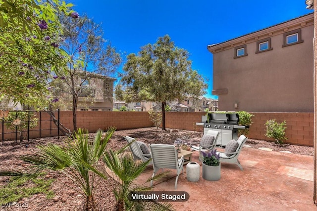 view of patio featuring a fenced backyard and area for grilling