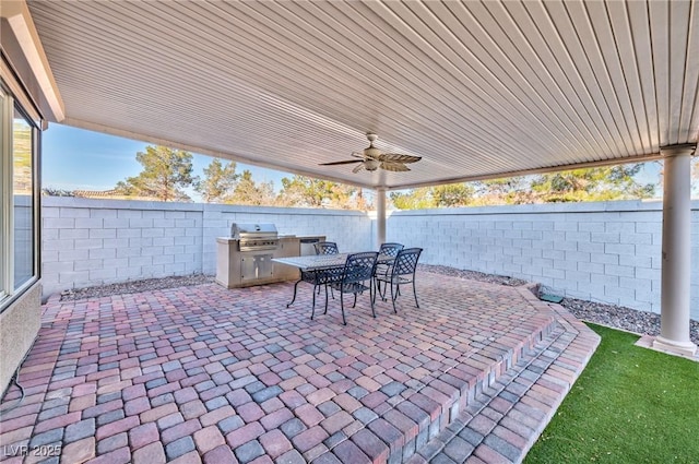 view of patio / terrace with a fenced backyard, ceiling fan, area for grilling, and outdoor dining space