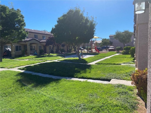 view of yard featuring playground community