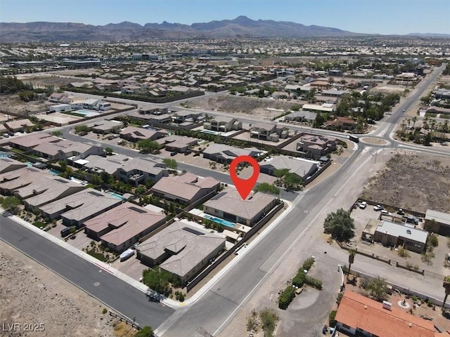 bird's eye view featuring a residential view and a mountain view