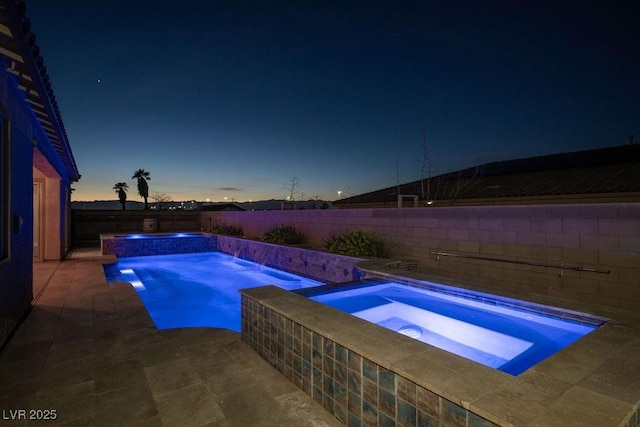 view of pool with a fenced backyard, a patio, a fenced in pool, and an in ground hot tub