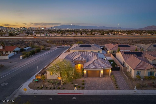 aerial view at dusk with a residential view and a mountain view