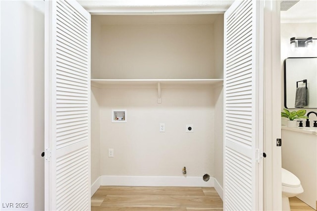 laundry area with laundry area, washer hookup, light wood-type flooring, and electric dryer hookup