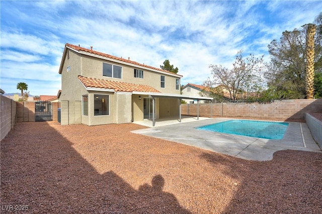 view of pool featuring a patio area, a fenced backyard, and a fenced in pool