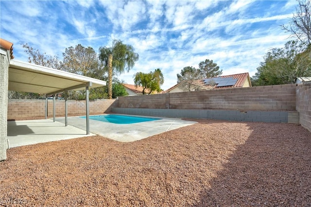 view of swimming pool featuring a patio area and a fenced backyard