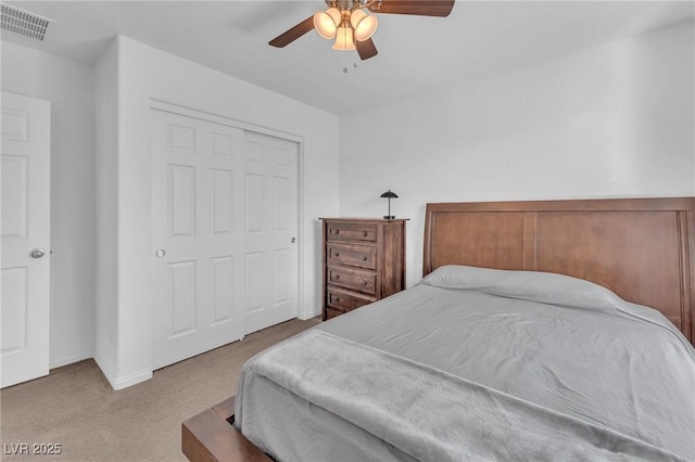 carpeted bedroom with ceiling fan, visible vents, and baseboards