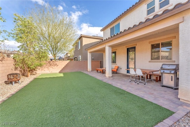 view of yard with a fenced backyard and a patio