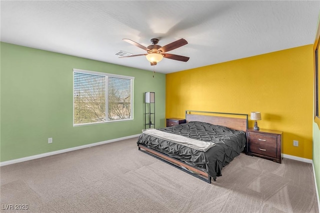 bedroom featuring ceiling fan, carpet flooring, visible vents, and baseboards