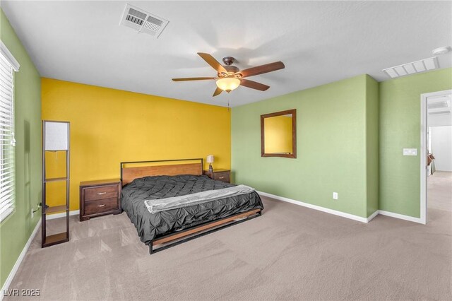 bedroom with carpet, visible vents, and baseboards