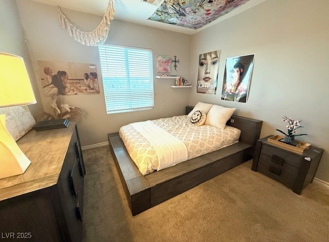 carpeted bedroom featuring visible vents and baseboards