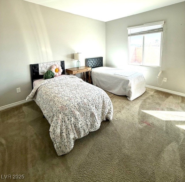 carpeted bedroom featuring baseboards