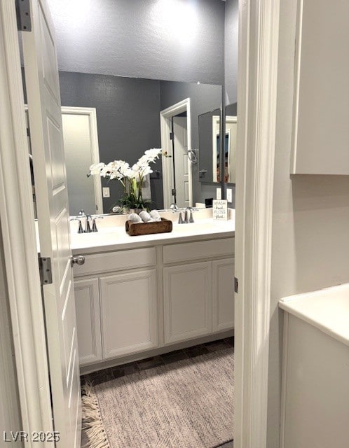 full bath featuring double vanity and a sink