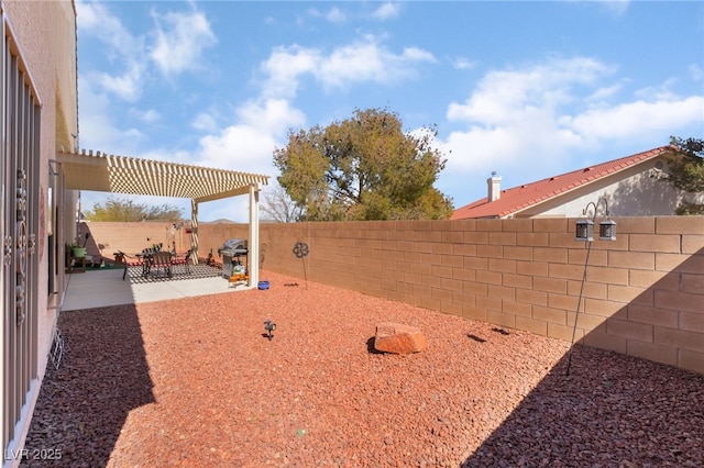 view of yard featuring a patio, a fenced backyard, and a pergola