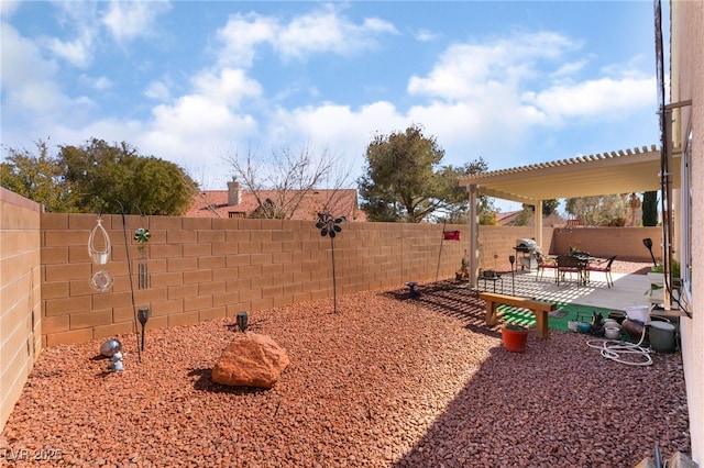 view of yard featuring a patio, a fenced backyard, and a pergola