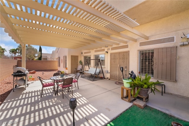 view of patio / terrace with grilling area, outdoor dining space, a pergola, and fence