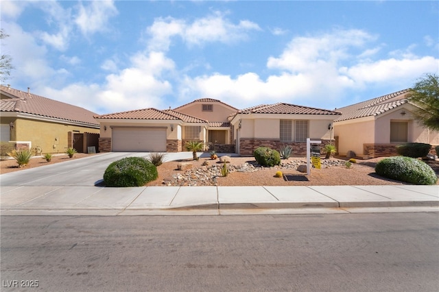 mediterranean / spanish house featuring a tiled roof, stone siding, driveway, and stucco siding