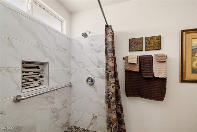 full bathroom with a tile shower