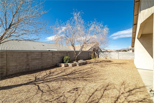 view of yard with a fenced backyard