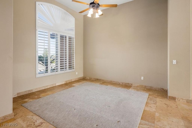 spare room with ceiling fan