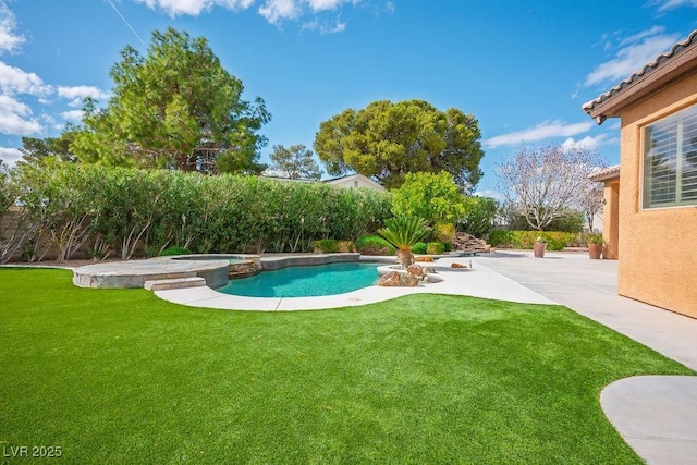 view of pool featuring a yard, a patio, a fenced backyard, and a pool with connected hot tub