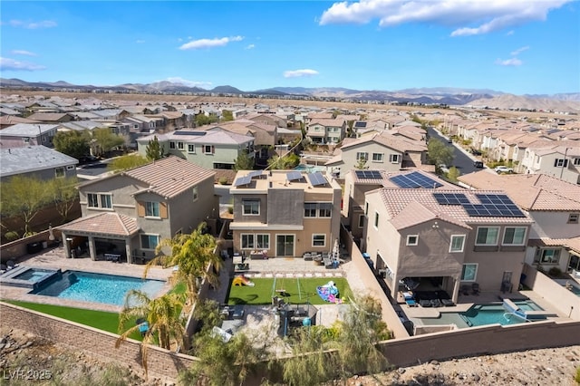 birds eye view of property featuring a residential view and a mountain view