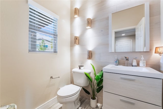 bathroom featuring backsplash, vanity, and toilet