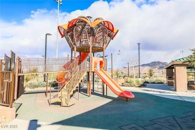 community play area featuring a mountain view