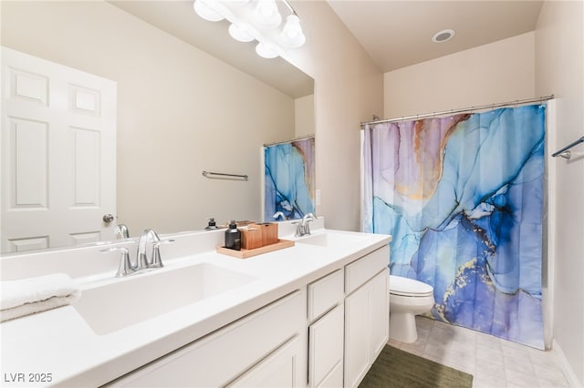 full bath featuring a sink, toilet, and double vanity