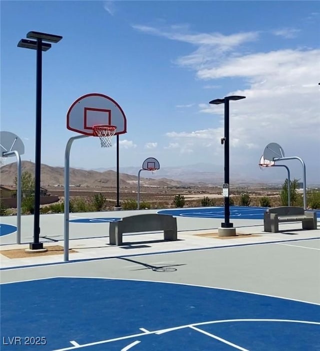 view of basketball court featuring community basketball court and a mountain view