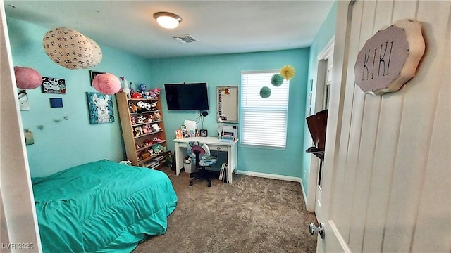 bedroom featuring visible vents and baseboards