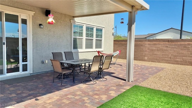 view of patio / terrace featuring outdoor dining space and fence