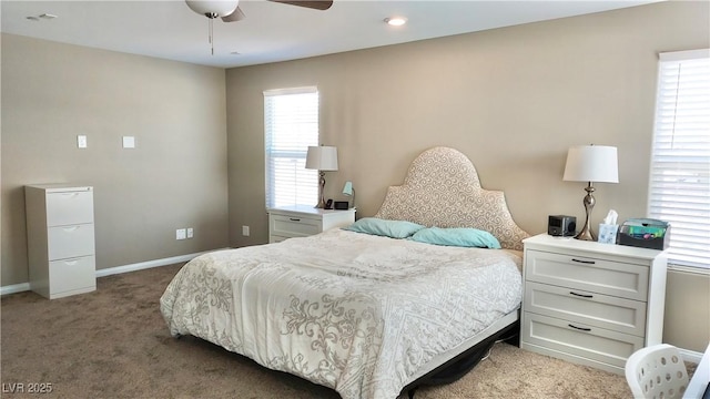 carpeted bedroom with baseboards and a ceiling fan