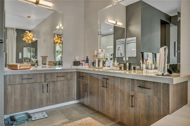 bathroom with tile patterned flooring and vanity