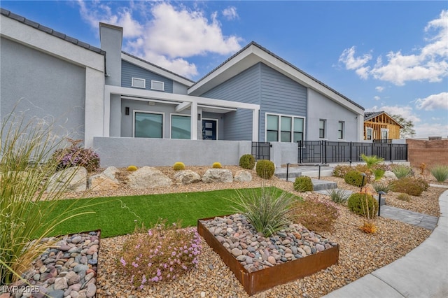 exterior space with fence and stucco siding