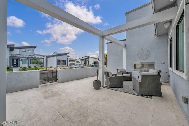 view of patio / terrace with a residential view and an outdoor living space