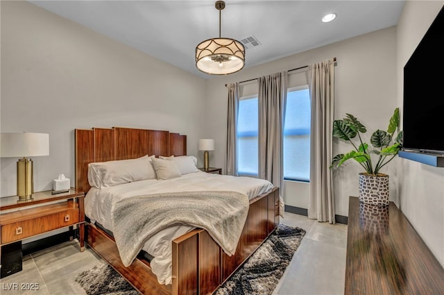 bedroom with recessed lighting, visible vents, and finished concrete flooring