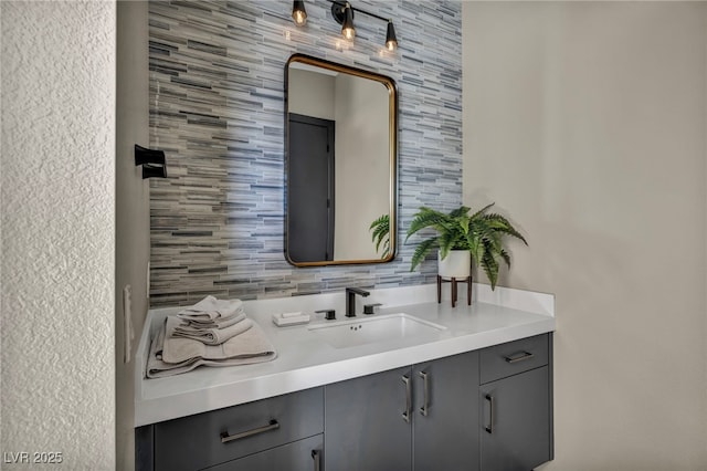 bathroom with decorative backsplash and vanity