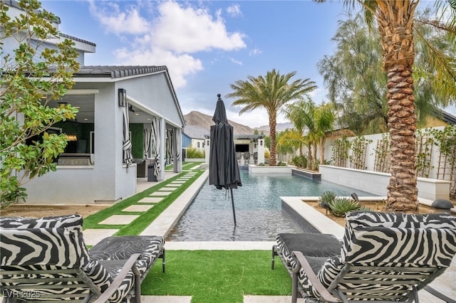 view of swimming pool with a patio area and a fenced in pool