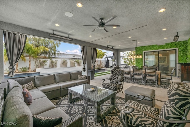 exterior space featuring a textured ceiling and recessed lighting