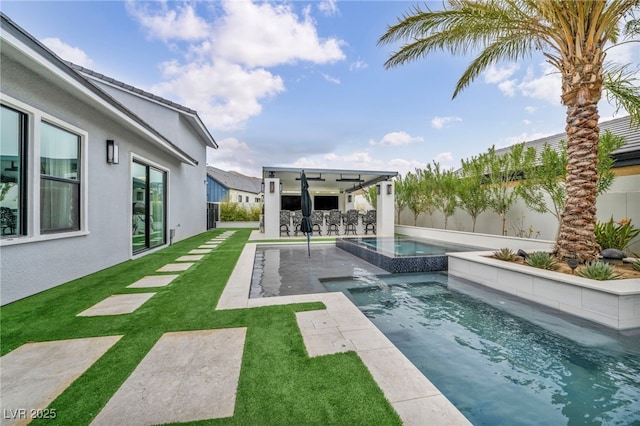 view of pool with an in ground hot tub, a fenced backyard, a patio, and a yard