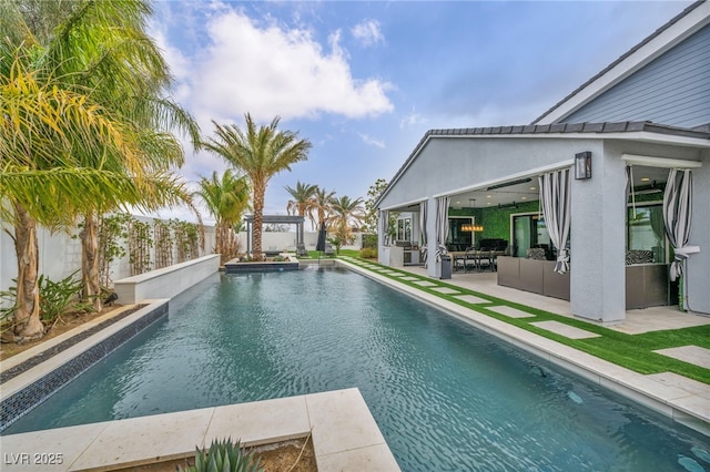 pool featuring a patio and fence