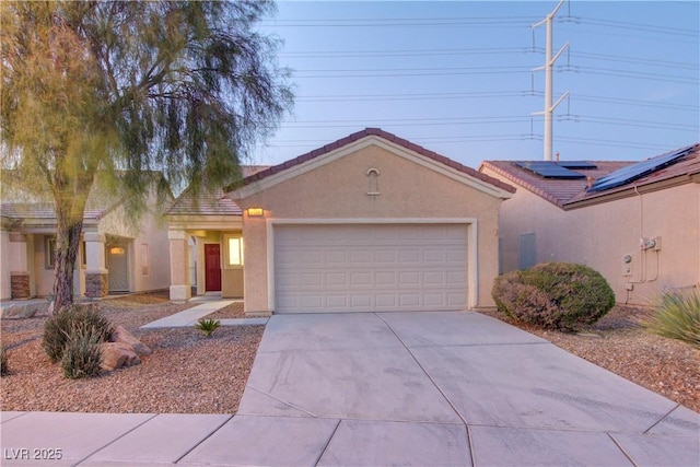 ranch-style home featuring a garage, driveway, a tiled roof, and stucco siding